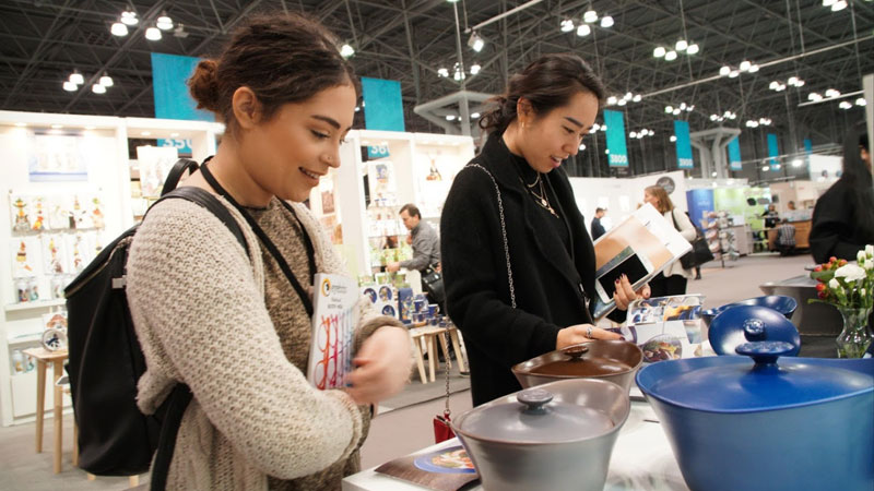 Students looking at housewares during a trade show