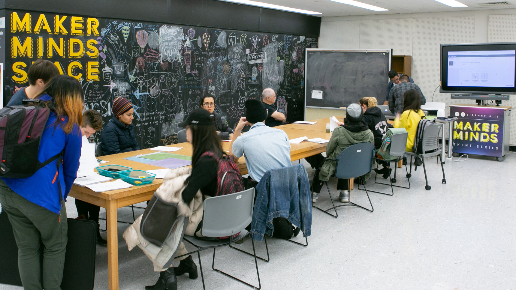 event in makerminds space with people around table