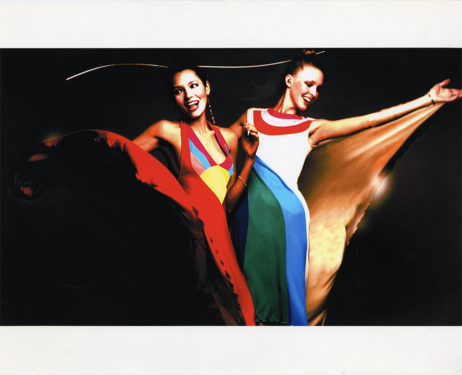 two female models wearing Stephen Burrows' brightly colored designs