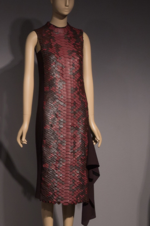 Sleeveless tube dress made from black and brown scalloped leather in the appearance of snakeskin