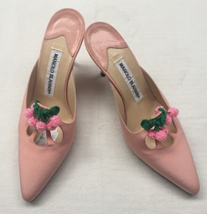 pink mule stilettos with petal cutout and glass bead tassles in the berry shapes at vamp