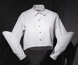 White collared shirt with center fasteners and long-sleeves with forearm additions