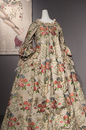 Robe a la francaise with a floral silk brocade shown from the back with its sack back