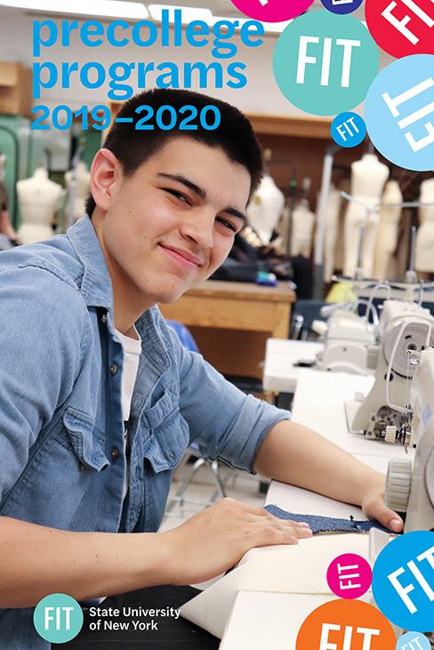 smiling boy at a sewing machine