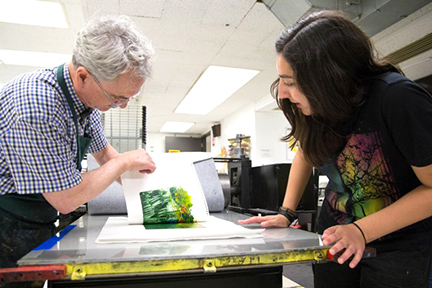 Student and teacher monoprinting together