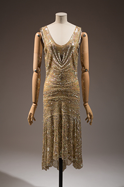 sleeveless, drop waist gold dress with beads and sequins