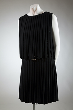 sleeveless black mini dress made up of wool pleats