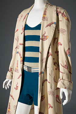 off-white beach robe with print of divers in brown, ochre, blue, and orange and wide pockets