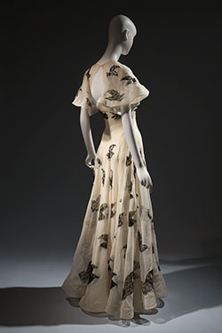 ivory floor length dress with black lace insets