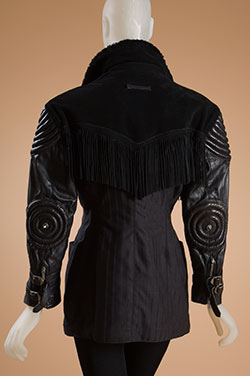 black faux fur roll collar, suede fringe shoulder yoje, leather sleeves with padded and topstitched upper arm and spiked elbows