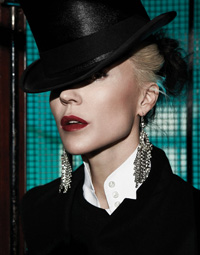 headshot of Daphne Guinness wearing a black top hat