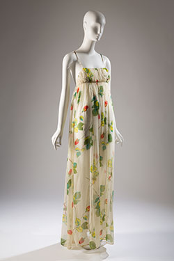 evening dress with nightgown silhouette in sheer white with printed design of long stem red roses