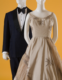 (Left) Man's tuxedo with black bowtie (Right) light brown sleeveless evening dress with metallic embroidered stars