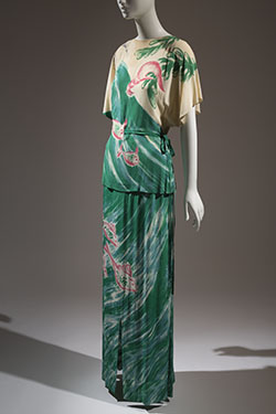 tunic an dlong skirt with large scale asymmetrical design of ocean waves, fish, and shells handpainted in shades of green, blue, and pink