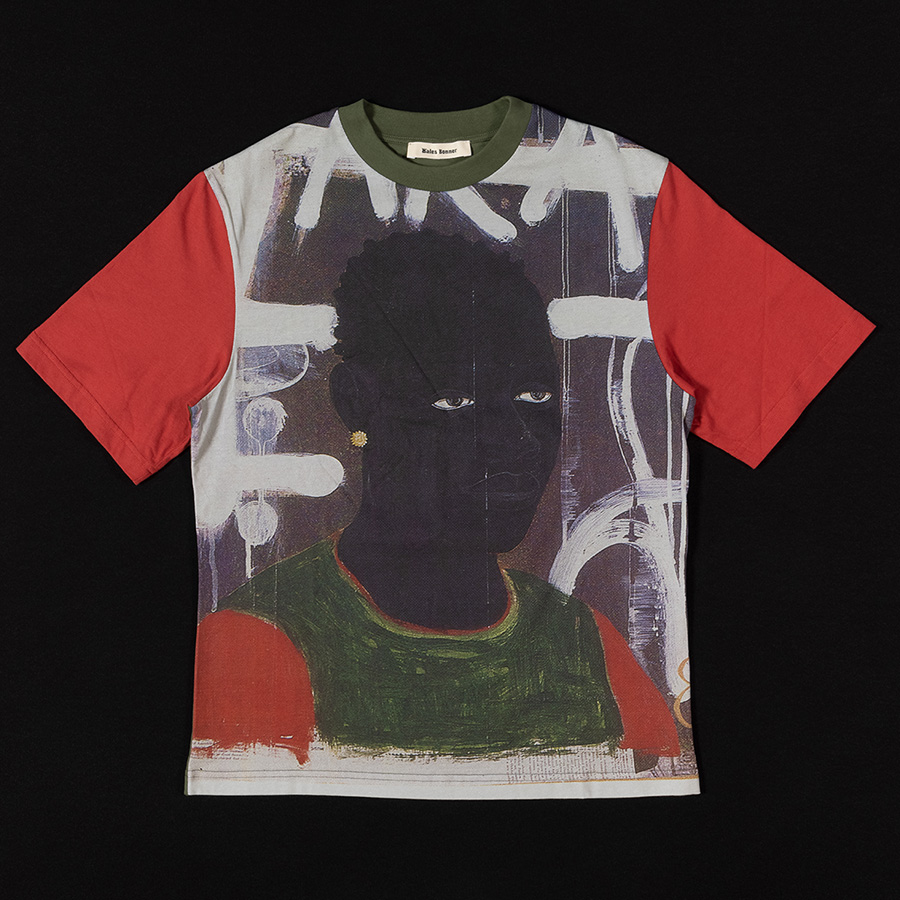tshirt with red sleeves and printed illustration of black man wearing a green shirt with red sleeves