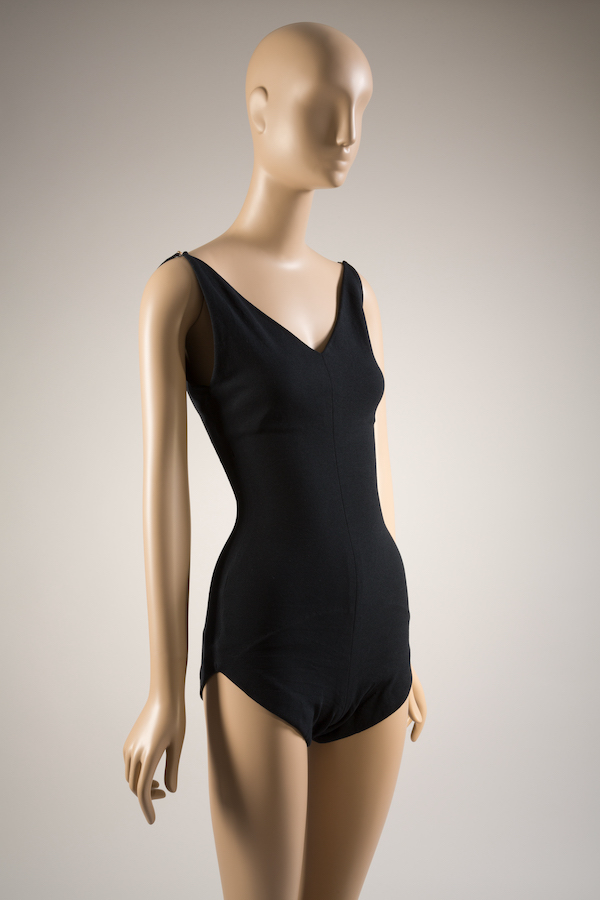 Black one-piece bathing suit on a mannequin
