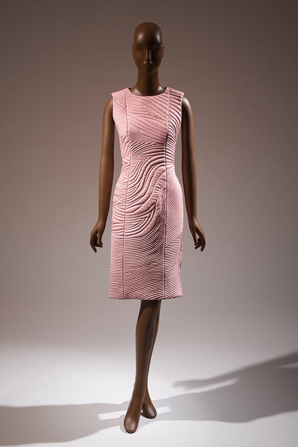 pink fitted sleeveless leather dress with trapunto quilting at front