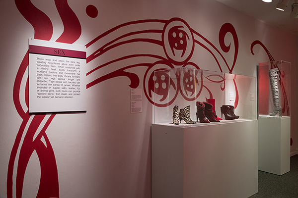 installation image of sex section of boots, with a white wall and red swirls