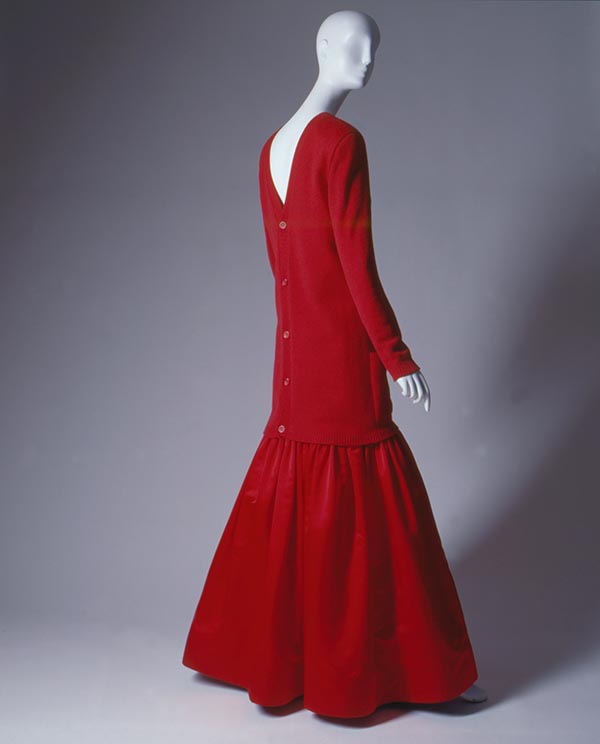 red monochrome ensemble with a long cardigan and floor length silk satin skirt