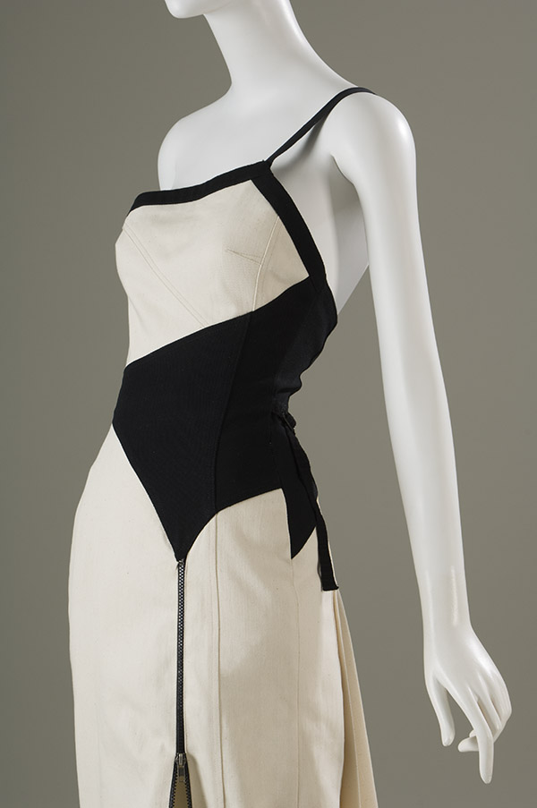 white and black floor length dress with pleats at waist and detachable train
