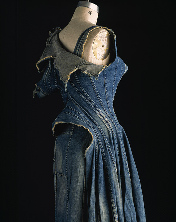 long deconstructed denim dress with multiple welt seam construction down bodice creating boned effect with stine washed spots