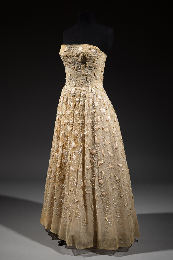 strapless, floor-length evening dress covered in beads and paillettes