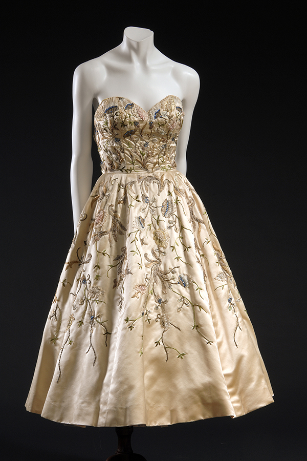 strapless, knee-length ivory evening dress embroidered with flowers
