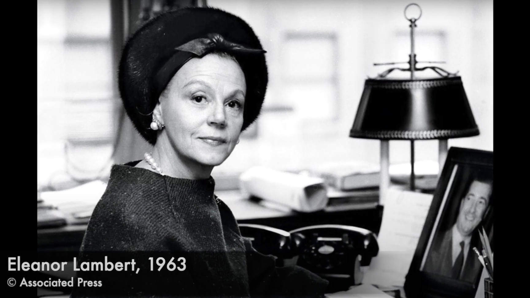 black and white image of Eleanor Lambert at her desk 