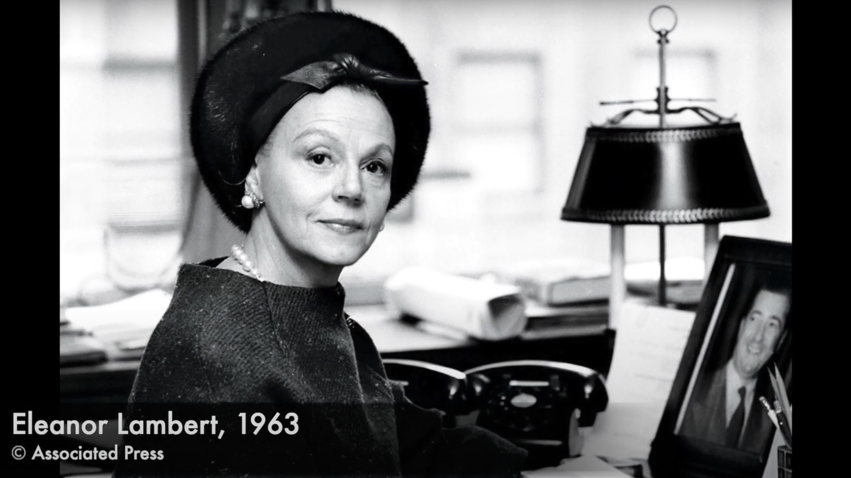 black and white image of Eleanor Lambert at her desk