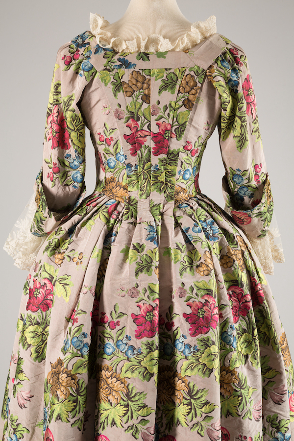 robe a l'anglaise gown with brightly colored large floral patterns in shades of pink, green, brown, and blue