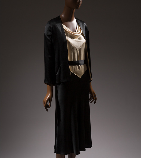Matching dress and jacket in black silk crepe with contrasting off white crepe bodice