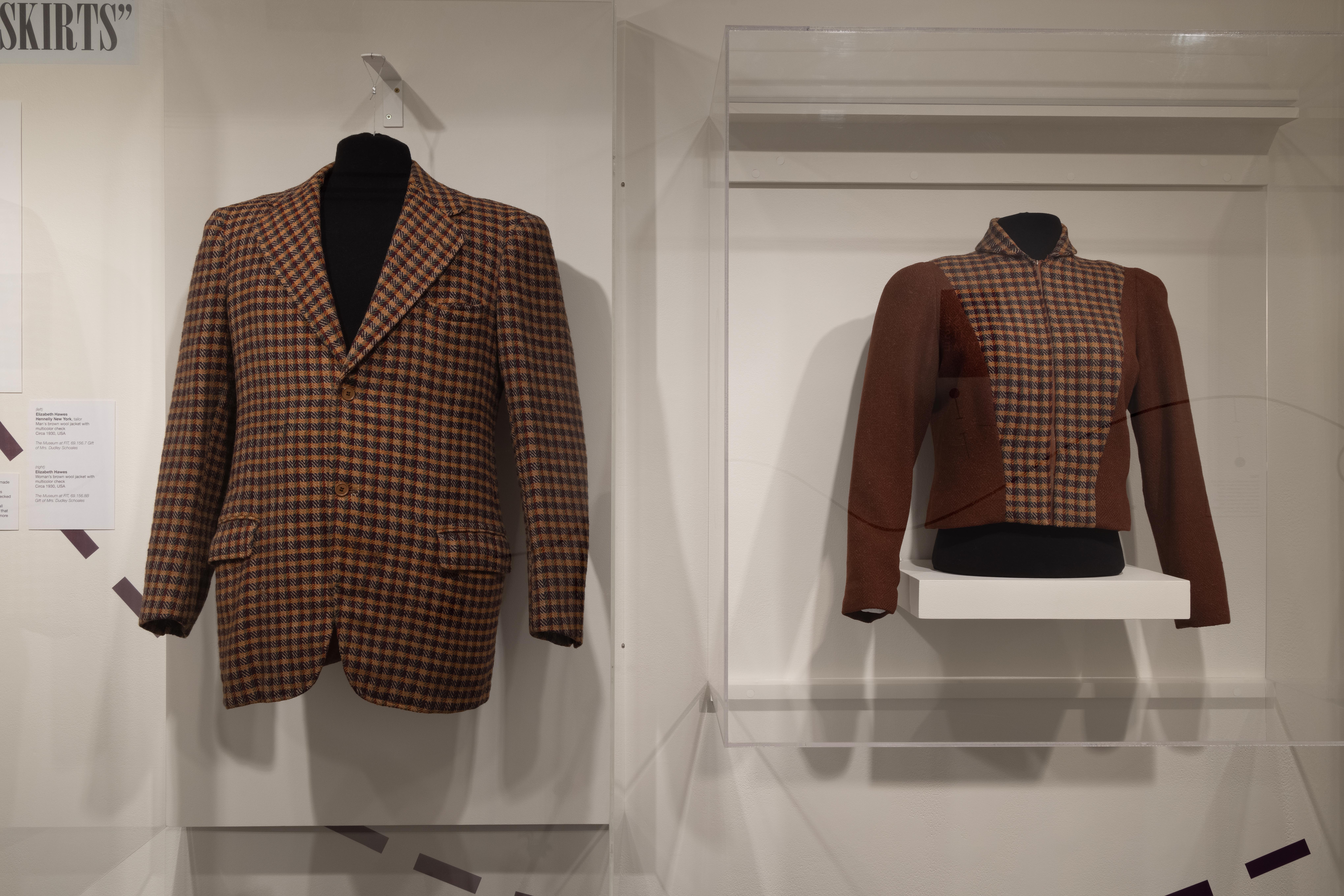 a man and women's jacket made of the same fabric side by side in a glass container