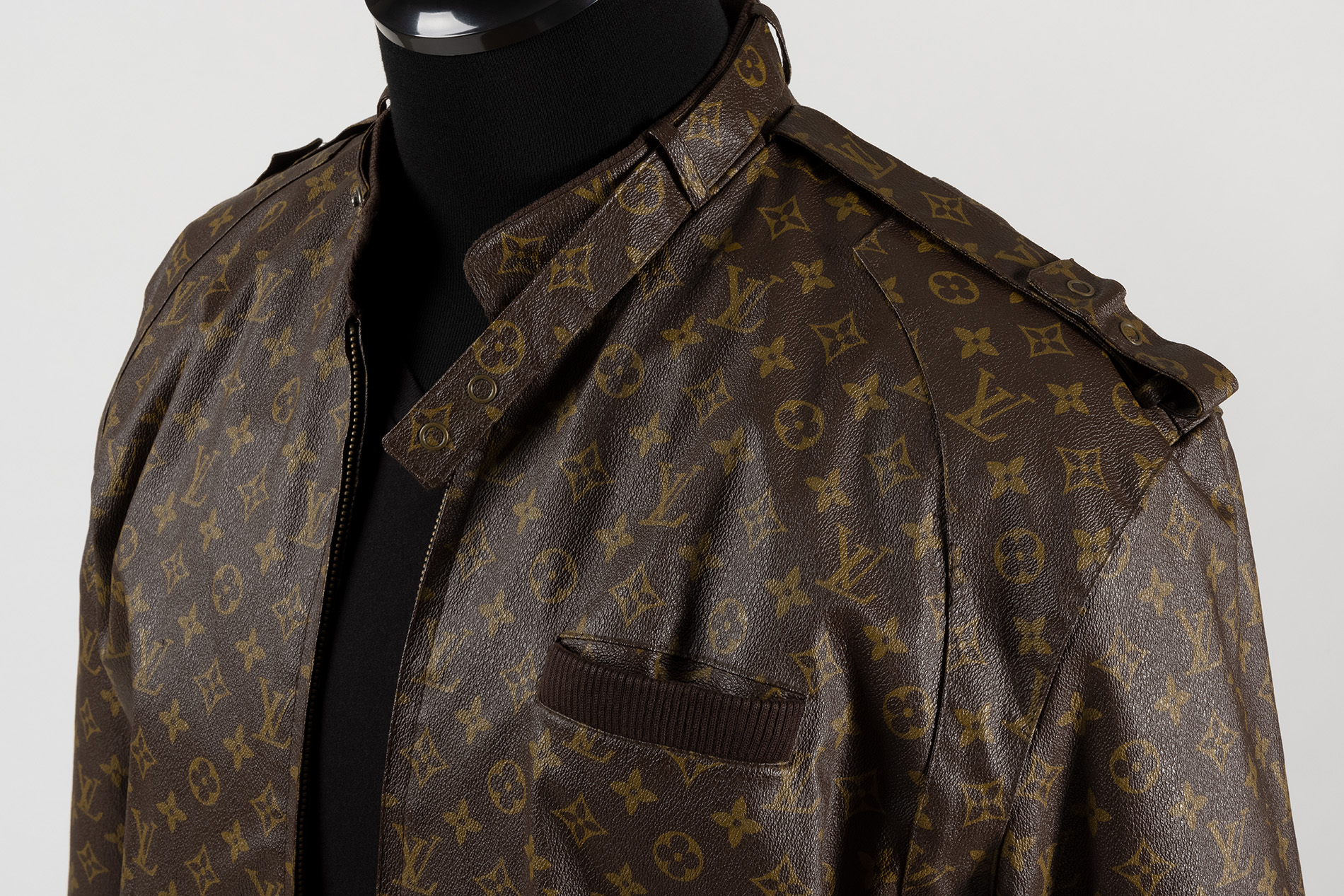 brown customized logo jacket by dapper dan