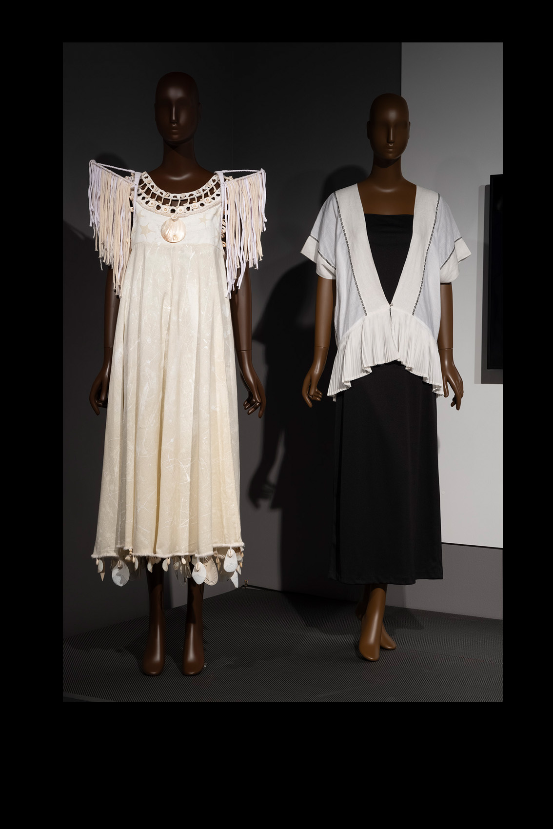 Moda Hoy installation of two dresses on mannequins, both with work by indigenous artisans