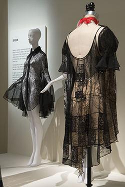 two mannequins dressed in lace ensembles on platform