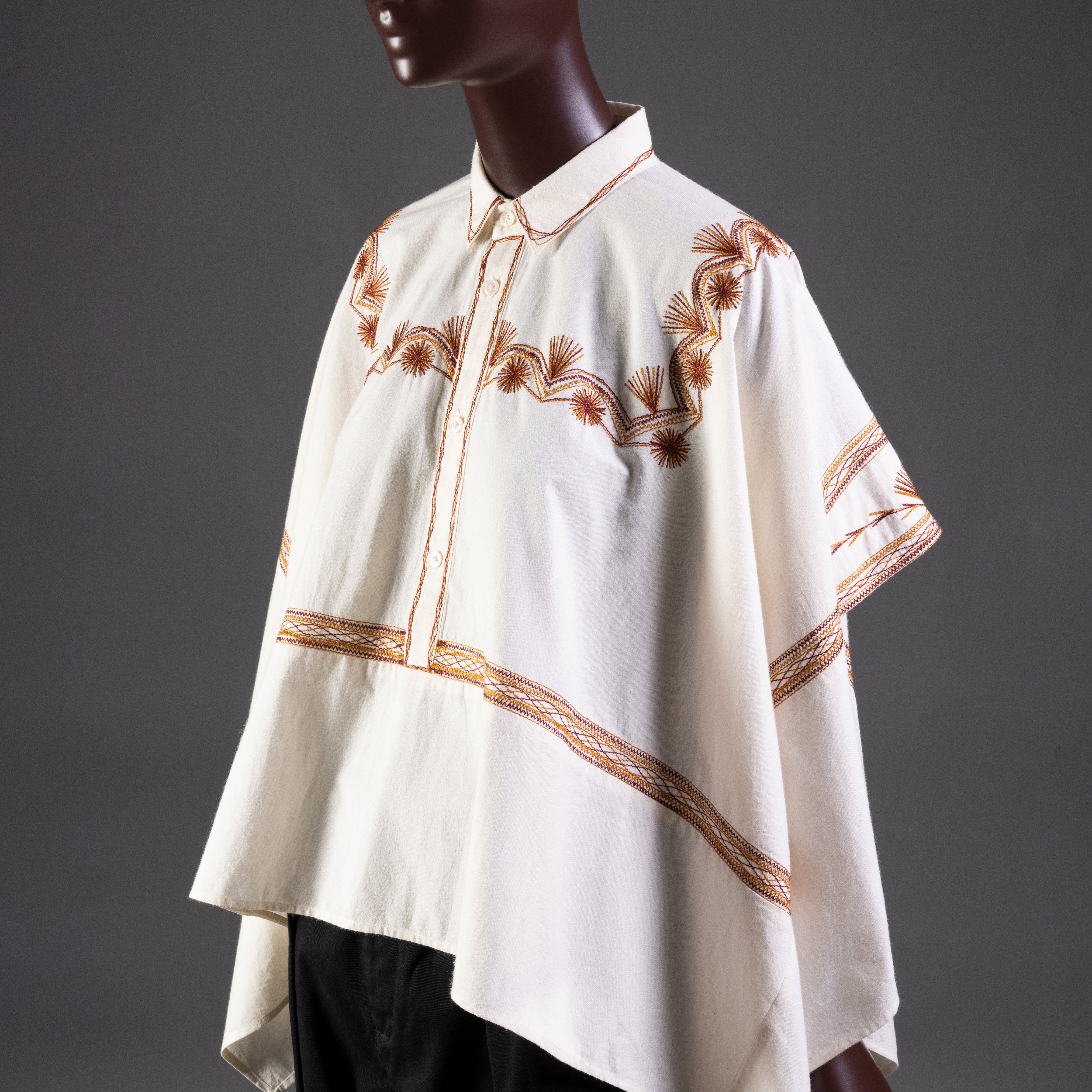 White button down shirt with collar and red-orange embroidered details