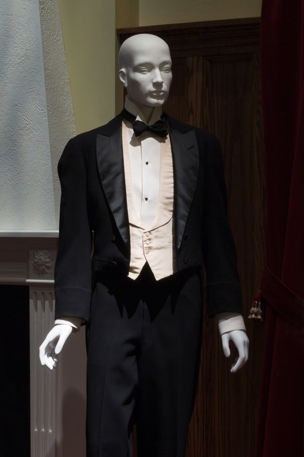 Man’s black tuxedo with cream vest and white shirt