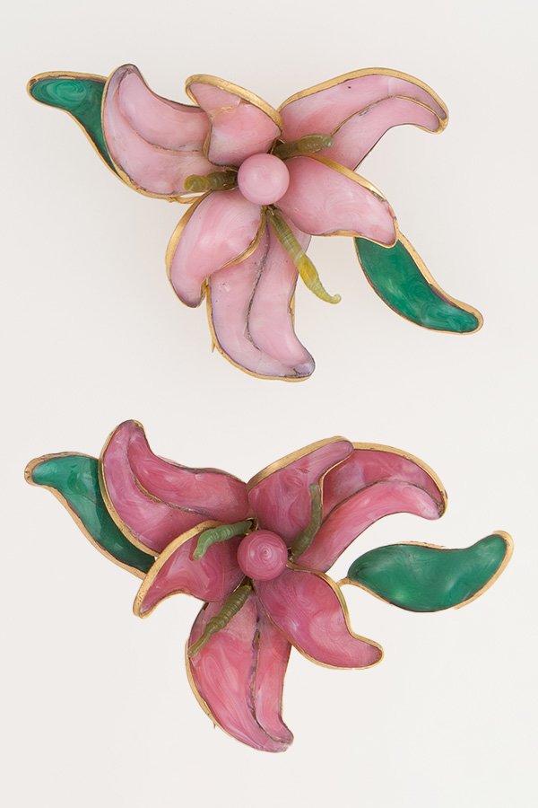 Pair of orchid-like brooches with green leaves 