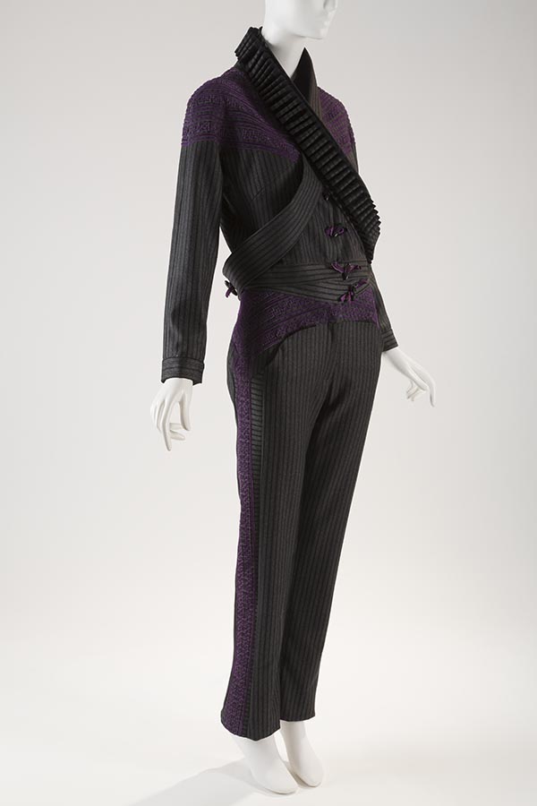 striped black pantsuit with purple details and belt wrapping around bodice