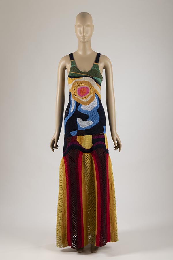 Sleeveless full-length multicolored crochet dress on a mannequin