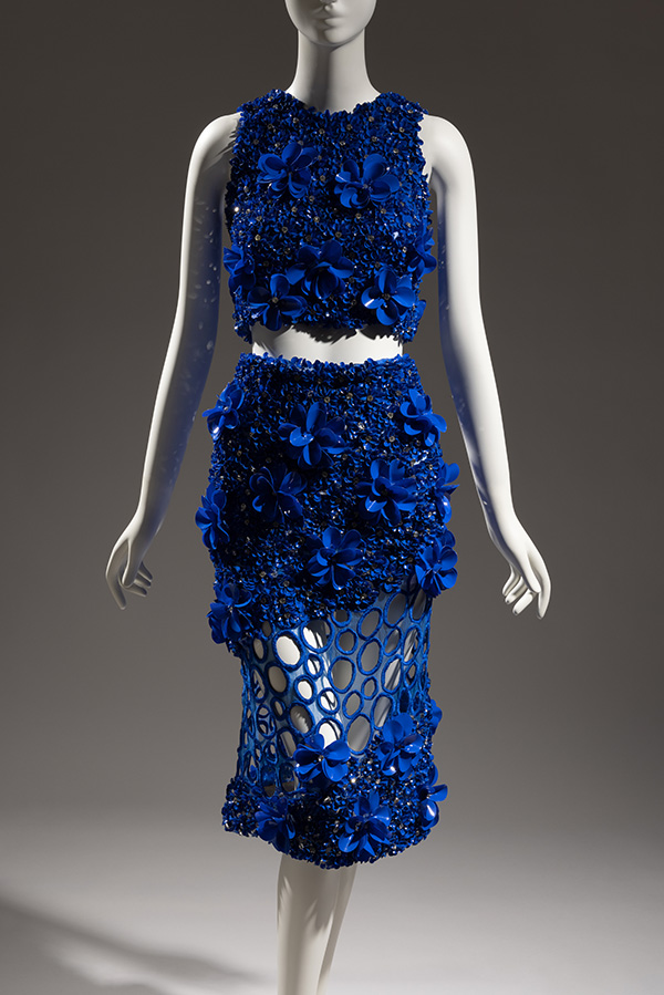 blue top and skirt ensemble with flowers and netting