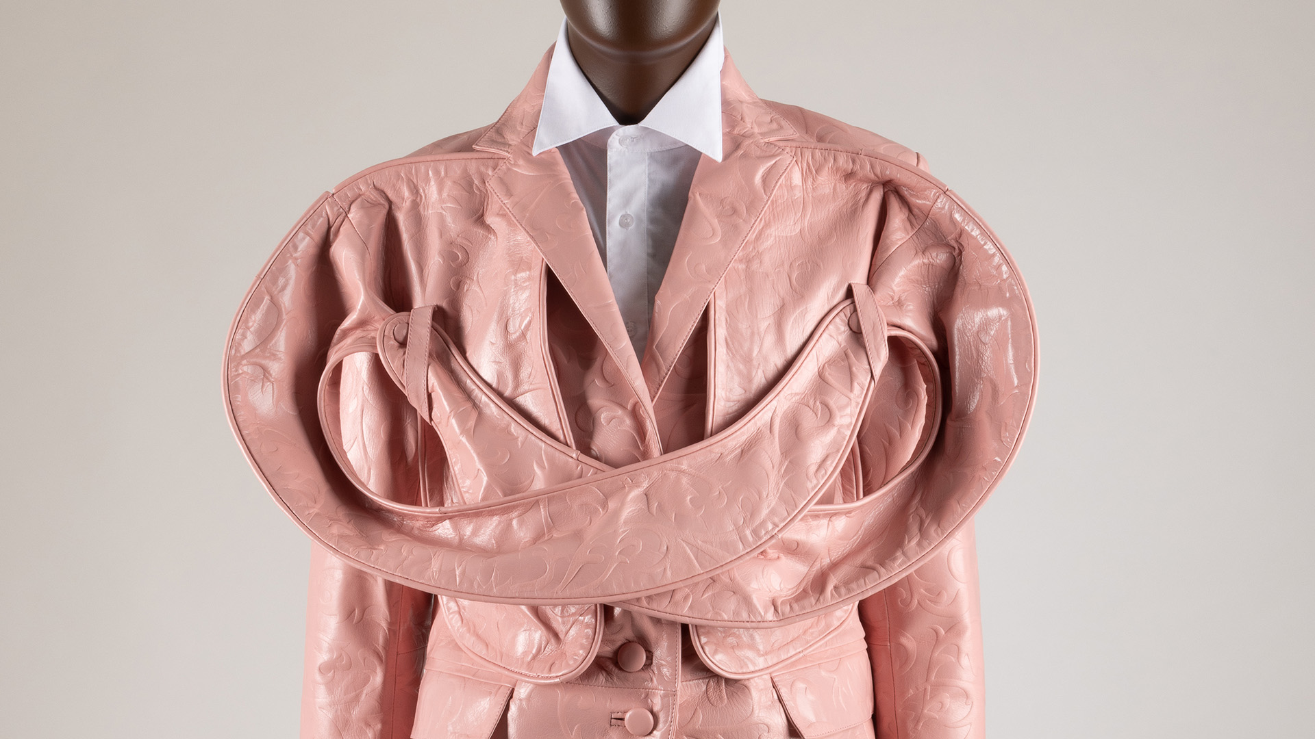 pink embossed leather suit with puffed collars