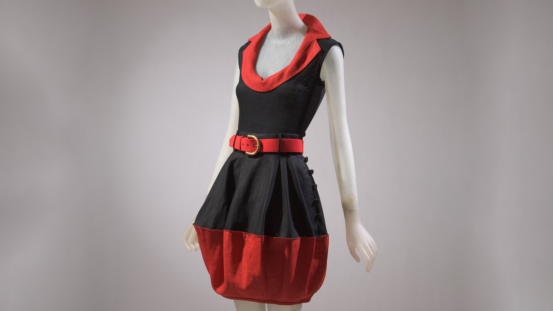 black dress with red collar and belt