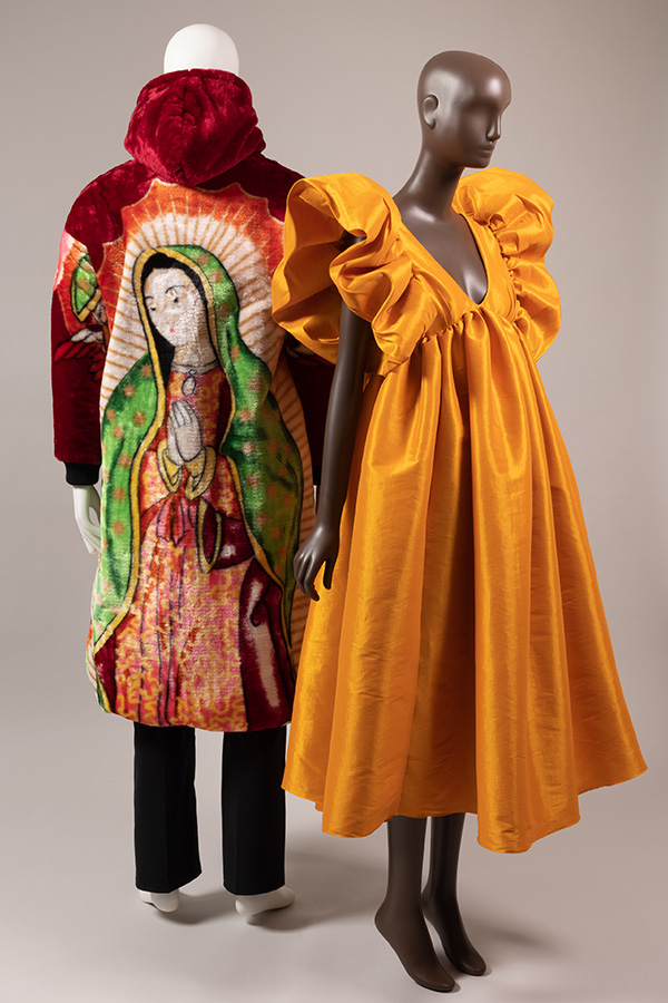 back view of a red coat with image of lady of guadeloupe and front view of a mustard yellow dress with ruffle sleeves