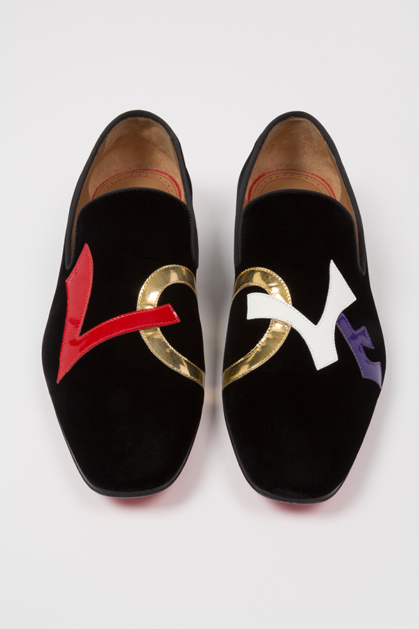 Pair of loafers with letters on each shoe spelling out LOVE