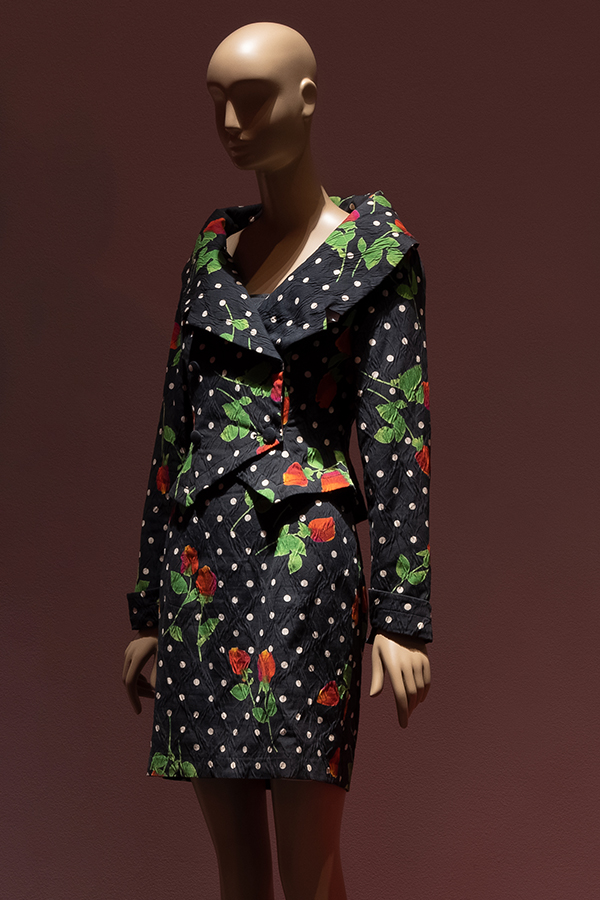 Strapless dress and matching doublebreast jacket in dark blue cotton with orange, red and yellow tipped roses on green leaf stem and off white polka dot print