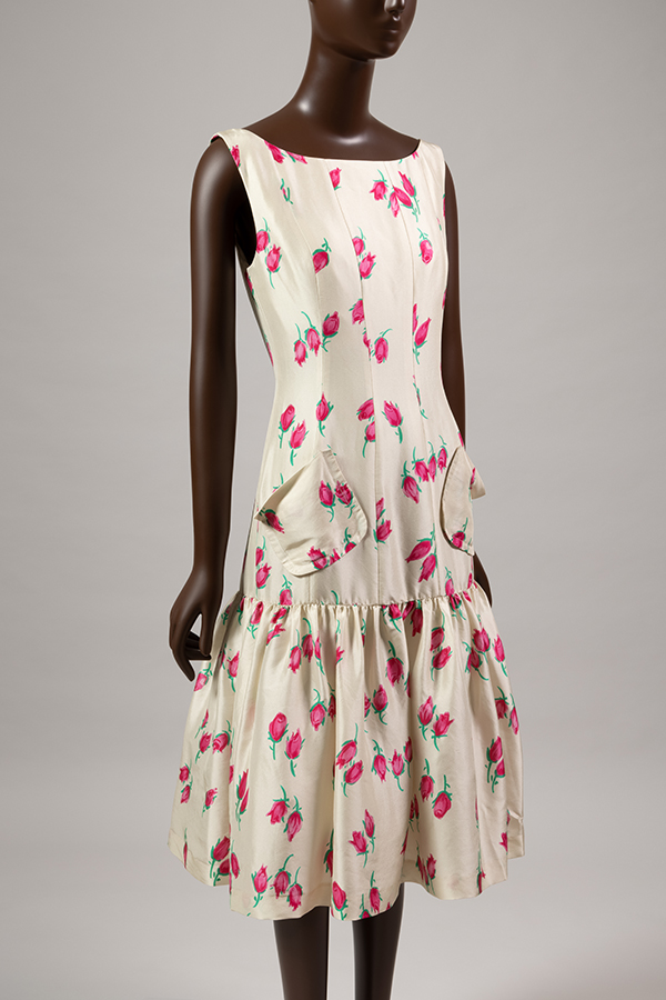 Off white sleeveless dress with red, pink, and green rose print