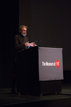 Fred Dennis speaking at a podium