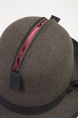 close up image of hat with zipper opening at the top