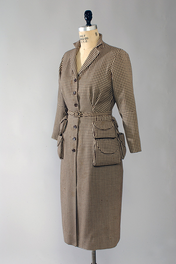 long sleeve houndstooth dress with eight large pockets around the hips